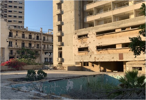 Figure 2: The empty pool of the Aspelia Hotel with bullet holes visible above it.